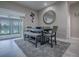 Dining area with views to the lake and sliding glass doors to the outdoor living space at 5905 Caulk Ct, The Villages, FL 32163