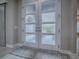Elegant entryway features frosted glass doors and a stylish rug at 5905 Caulk Ct, The Villages, FL 32163