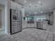 Contemporary kitchen with stainless steel appliances and a breakfast bar at 5905 Caulk Ct, The Villages, FL 32163
