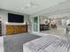 Spacious sunroom connected to an open-concept living area with elegant furniture and decor at 5905 Caulk Ct, The Villages, FL 32163