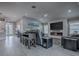 Spacious living room with a modern fireplace, large TV and comfortable seating area at 5905 Caulk Ct, The Villages, FL 32163