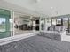 Open floor plan with seamless transition to the sunroom, featuring modern furnishings and natural light at 5905 Caulk Ct, The Villages, FL 32163