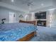 Beautiful main bedroom with an entertainment center featuring an electric fireplace at 5905 Caulk Ct, The Villages, FL 32163