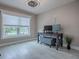 Bright office with a large window, desk, computer and plant at 5905 Caulk Ct, The Villages, FL 32163