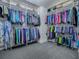 Spacious walk-in closet with ample hanging storage and grey carpeting at 5905 Caulk Ct, The Villages, FL 32163