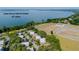 Aerial view of condo community, close to Lake Dora, surrounded by trees and next to West Old US 441 at 601 W Old Hwy 441 # 11B, Mount Dora, FL 32757