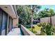 View from the balcony of the lush landscaping and exterior architecture of the building and surrounding area at 601 W Old Hwy 441 # 11B, Mount Dora, FL 32757