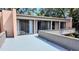 Balcony overlooking trees and other buildings, providing a sense of privacy and space at 601 W Old Hwy 441 # 11B, Mount Dora, FL 32757