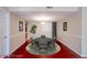 Dining room featuring a modern table with chairs, a stylish light fixture, and red wood floors at 601 W Old Hwy 441 # 11B, Mount Dora, FL 32757
