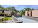 Expansive view from the balcony showing well-maintained landscaping and neighboring buildings at 601 W Old Hwy 441 # 11B, Mount Dora, FL 32757