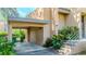 Charming carport entrance with lush greenery, stairs, and the unit number 11B visible at 601 W Old Hwy 441 # 11B, Mount Dora, FL 32757