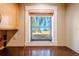 Kitchen window showcasing a serene view of lush greenery and a glimpse of the water at 601 W Old Hwy 441 # 11B, Mount Dora, FL 32757