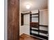 Spacious walk-in closet with wood-style shelving and storage for clothes, shoes and accessories at 601 W Old Hwy 441 # 11B, Mount Dora, FL 32757