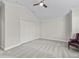 This bedroom offers neutral carpet, trim, and a vaulted ceiling with a fan at 631 Independence Path, The Villages, FL 32163