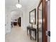 Inviting foyer with tile flooring, arched doorway, and a glimpse into the living room at 631 Independence Path, The Villages, FL 32163