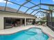 Enclosed pool with plenty of lounging space and adjacent access to indoor living areas at 631 Independence Path, The Villages, FL 32163