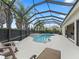 Screened-in pool and deck with outside seating; great for entertaining or enjoying the weather at 631 Independence Path, The Villages, FL 32163