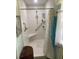 Bathroom featuring a shower with a built-in seat, grab bars, and updated fixtures at 66 Elmwood Trl, Deland, FL 32724