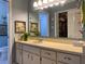 Bathroom featuring a spacious vanity, ample storage, and a well-lit mirror at 66 Elmwood Trl, Deland, FL 32724