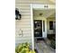 Home featuring an inviting front entrance with a charming welcome sign and colorful decorations at 66 Elmwood Trl, Deland, FL 32724