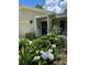 Home featuring a lovely front porch adorned with beautiful flowering bushes and tasteful decorations at 66 Elmwood Trl, Deland, FL 32724