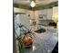Kitchen featuring granite countertops, white cabinets, and stainless-steel appliances at 66 Elmwood Trl, Deland, FL 32724