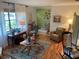 Inviting living room filled with art, comfortable seating, and warm lighting, offering a welcoming atmosphere at 66 Elmwood Trl, Deland, FL 32724