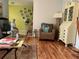 Bright living room with hardwood floors, comfortable seating, and stylish furnishings at 66 Elmwood Trl, Deland, FL 32724