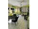 Inviting sunroom with tile flooring, comfortable seating, and lots of natural light at 66 Elmwood Trl, Deland, FL 32724