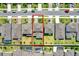 High definition aerial view shows this home's backyard with green lawn and its position within the community at 7627 Taormina Way, Clermont, FL 34714