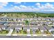 Aerial view of a home in a residential area near a lake, offering scenic community living at 7627 Taormina Way, Clermont, FL 34714