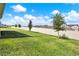 A spacious backyard showcasing lush greenery and a privacy fence, perfect for outdoor enjoyment at 7627 Taormina Way, Clermont, FL 34714