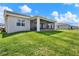 Expansive backyard with lush green grass, offering ample space for outdoor activities and enjoyment at 7627 Taormina Way, Clermont, FL 34714