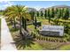 Landscaped entrance sign of the Ridgeview community with manicured greenery and palm trees at 7627 Taormina Way, Clermont, FL 34714