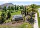 Ridgeview community entrance sign with lush landscaping and stone accents, offering a welcoming view at 7627 Taormina Way, Clermont, FL 34714
