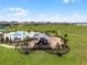 Community playground and pool in a well-maintained neighborhood with sprawling green space, perfect for Gathering activities at 7627 Taormina Way, Clermont, FL 34714