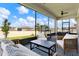 Relaxing screened porch with comfortable seating and outdoor dining, perfect for leisure at 7627 Taormina Way, Clermont, FL 34714