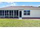 A screened lanai provides a transition from the interior to the outdoors at 815 Cortez Ave, Lady Lake, FL 32159