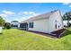 A spacious and well-manicured backyard, perfect for outdoor activities and entertaining at 815 Cortez Ave, Lady Lake, FL 32159