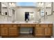 Bathroom with double vanity and walk in closet with lots of light from window at 815 Cortez Ave, Lady Lake, FL 32159