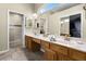 Spacious bathroom features dual sinks, a large mirror, and a separate shower at 815 Cortez Ave, Lady Lake, FL 32159