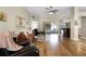 Inviting living room with wood floors and a sliding glass door leading to an outdoor patio at 815 Cortez Ave, Lady Lake, FL 32159