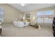 Comfortable primary bedroom with a ceiling fan and a large window for natural light at 815 Cortez Ave, Lady Lake, FL 32159
