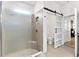 Modern bathroom featuring a glass shower and toilet room with sliding door, offers a spa-like feel at 8178 Penrose Pl, Wildwood, FL 34785