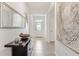 Open hallway with tiled floors, tasteful decor, and a view of the entryway at 8178 Penrose Pl, Wildwood, FL 34785