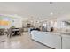 Spacious open-plan living area with a modern kitchen, dining area, and comfortable seating at 8178 Penrose Pl, Wildwood, FL 34785