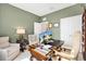 Home office featuring a large desk, ergonomic chair, and tasteful decor, promoting productivity at 8178 Penrose Pl, Wildwood, FL 34785