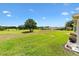 Expansive backyard overlooking a lush green golf course, offering serene views at 8779 Se 141St Lane Rd, Summerfield, FL 34491