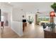 Open-plan living room with natural light, modern decor, and an inviting layout that flows into the dining area at 8779 Se 141St Lane Rd, Summerfield, FL 34491