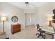Home office featuring a modern desk, wood floors, and artwork at 8779 Se 141St Lane Rd, Summerfield, FL 34491